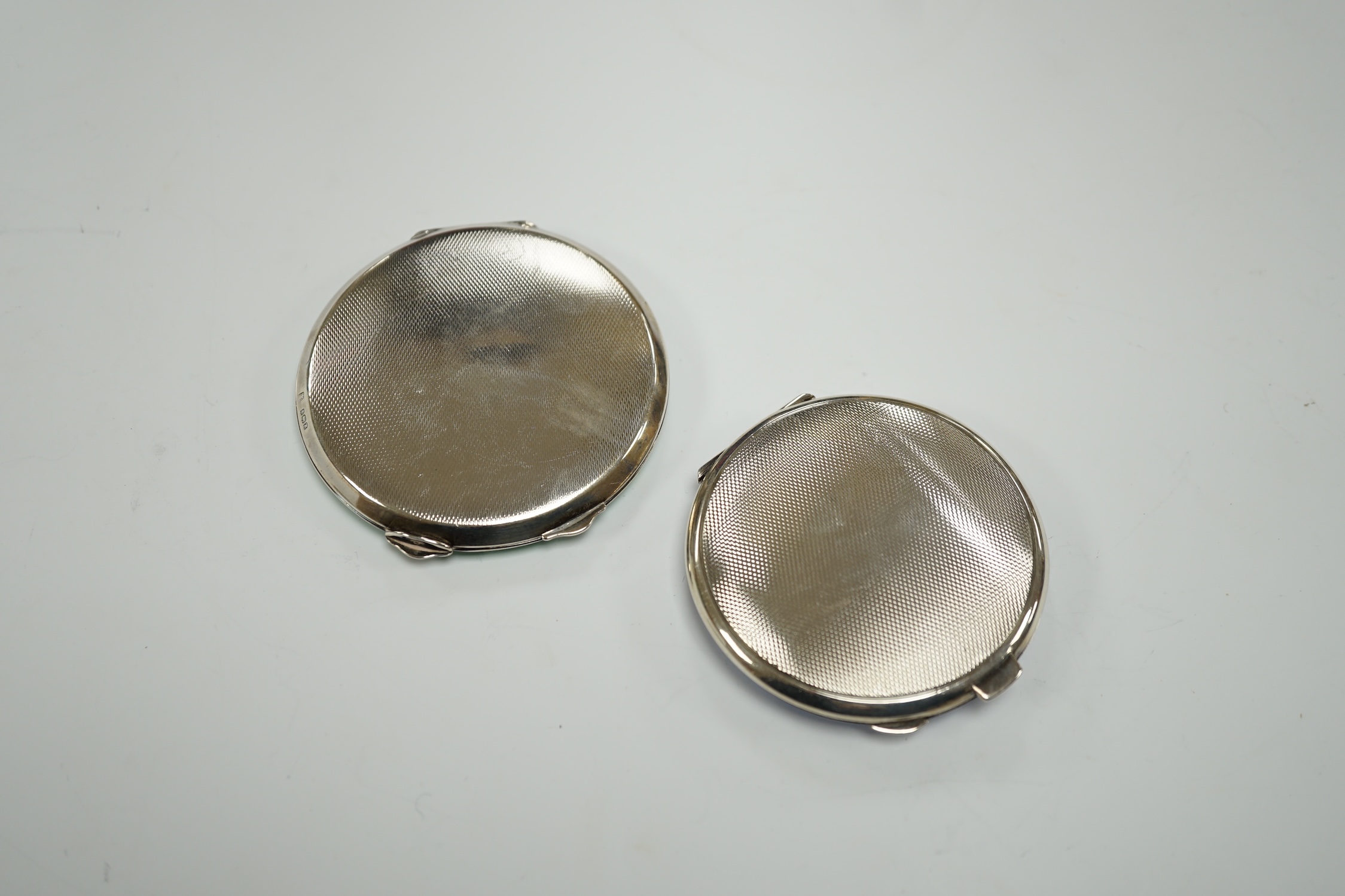 A 1930's blue enamelled silver compact, 63mm and one other unmarked enamelled compact.